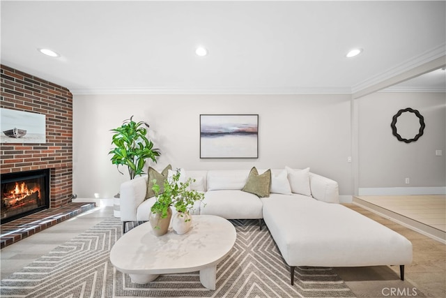 living room with recessed lighting, baseboards, a fireplace, and crown molding