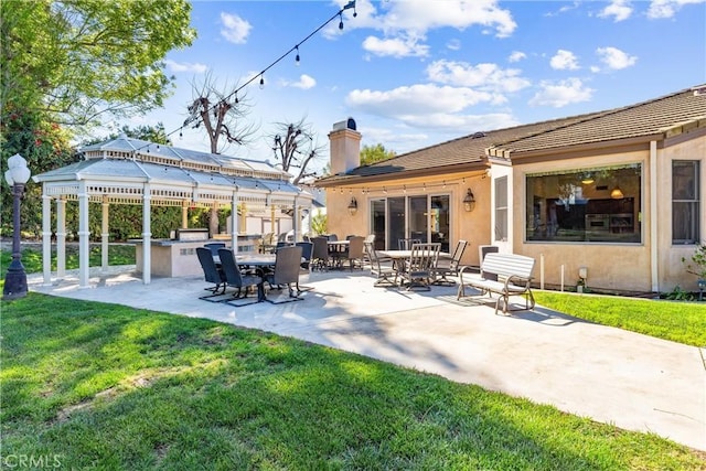 view of patio with an outdoor kitchen
