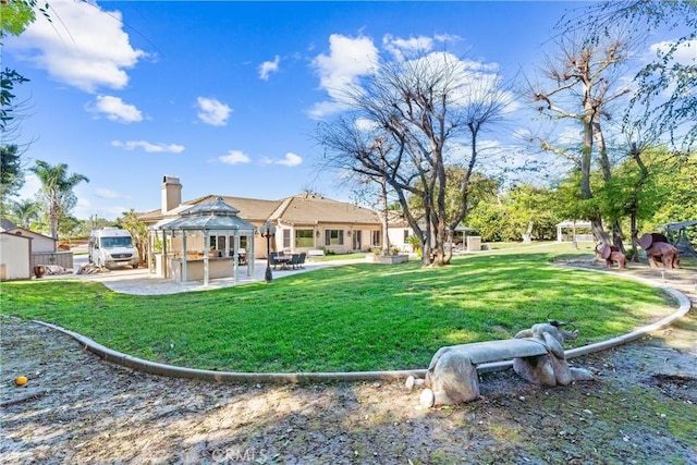 view of yard with a gazebo and a patio area