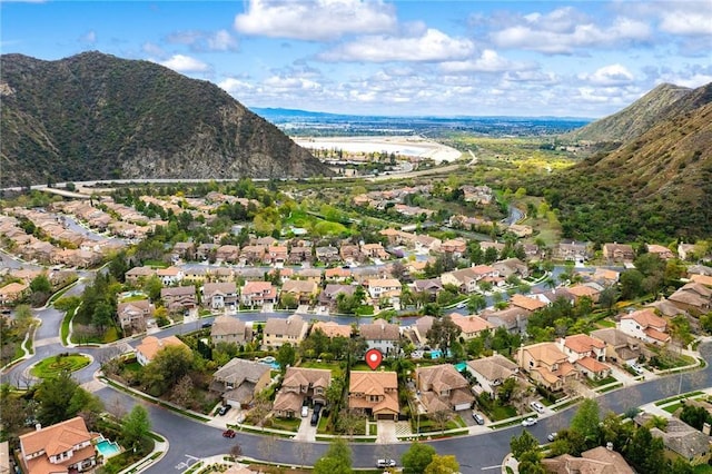 birds eye view of property featuring a mountain view and a residential view