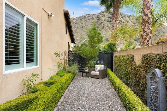 view of yard with a patio, fence private yard, and a mountain view