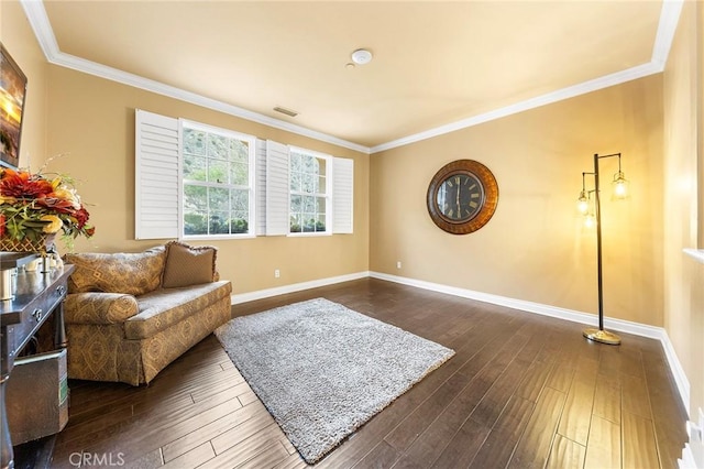 living area with baseboards, dark wood-type flooring, and crown molding