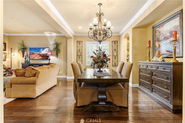 dining space featuring baseboards, an inviting chandelier, arched walkways, ornamental molding, and dark wood-type flooring