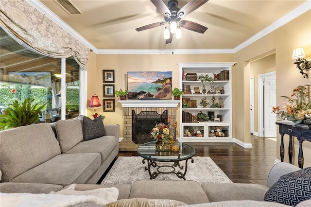 living area featuring visible vents, wood finished floors, ceiling fan, and ornamental molding