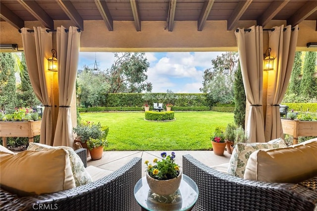 view of patio / terrace with an outdoor living space and a fenced backyard