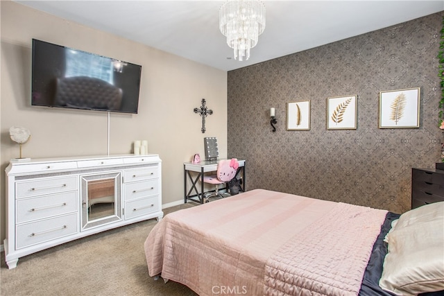 carpeted bedroom featuring baseboards and a notable chandelier