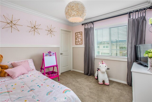 carpeted bedroom with baseboards and crown molding