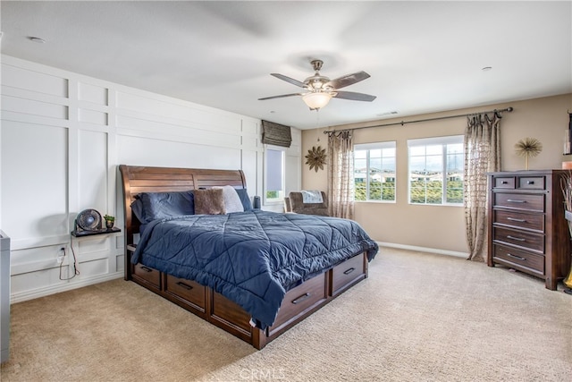 bedroom with baseboards, a ceiling fan, visible vents, and carpet floors