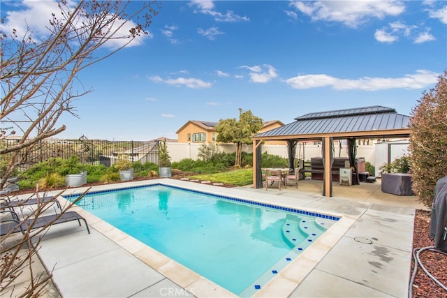 view of pool featuring a patio area, a fenced backyard, a fenced in pool, and a gazebo