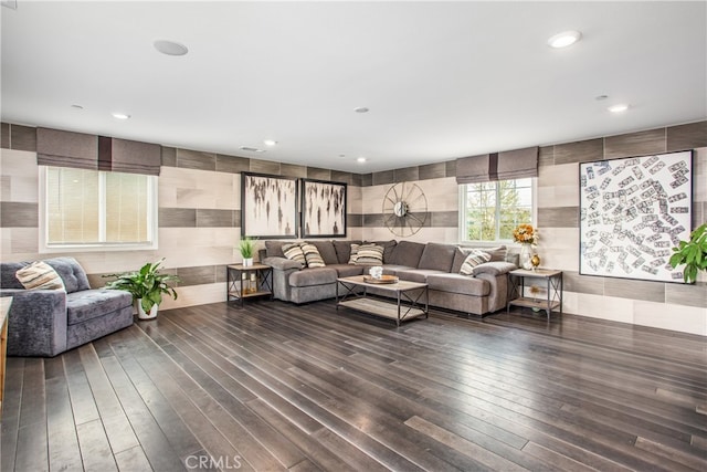 living area featuring recessed lighting and dark wood-type flooring