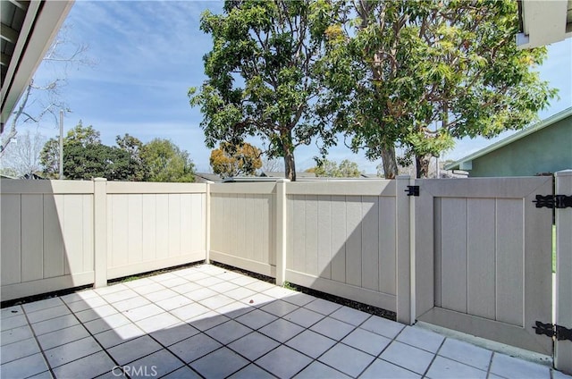 view of patio featuring a gate and a fenced backyard