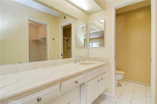 full bath with vanity, baseboards, visible vents, tile patterned floors, and toilet