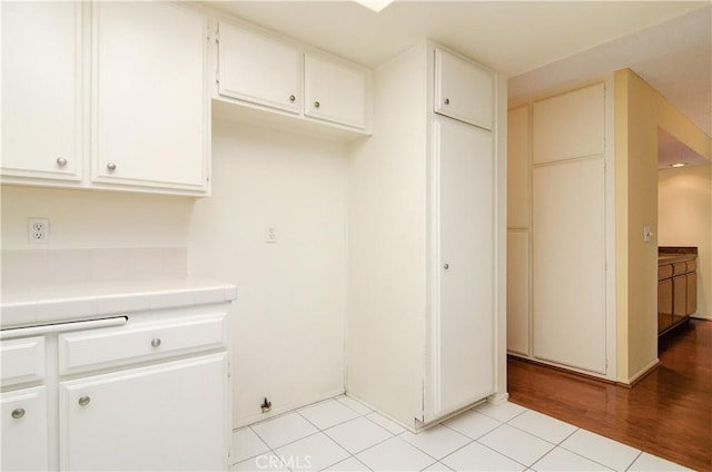 washroom with light tile patterned flooring