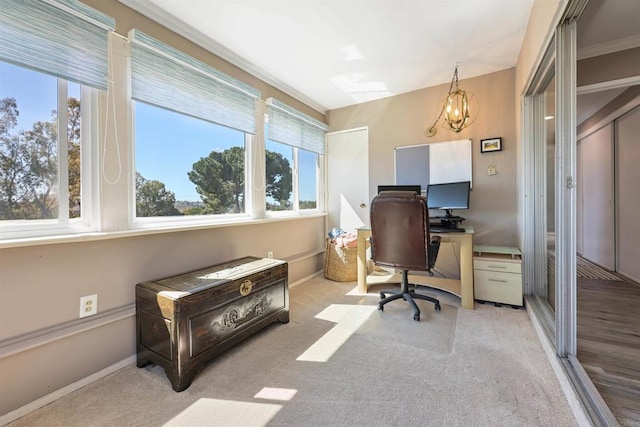 office space featuring carpet flooring, baseboards, and an inviting chandelier