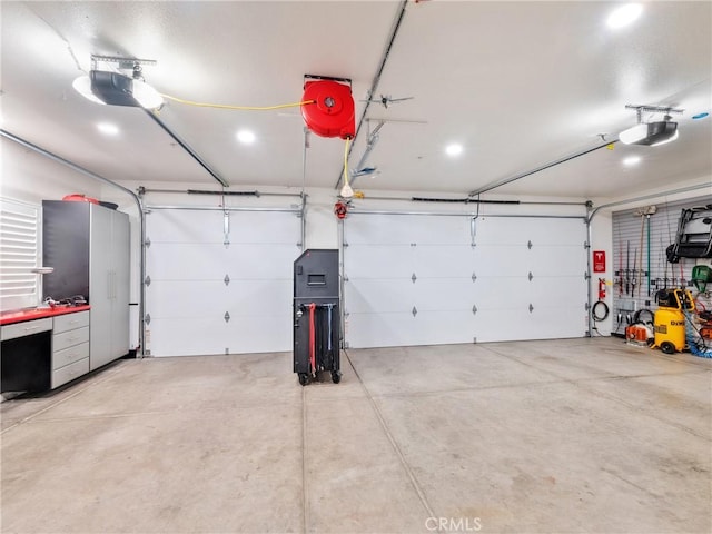 garage featuring a garage door opener