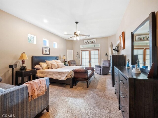 bedroom with light carpet and a ceiling fan