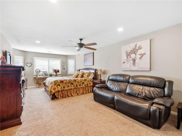 carpeted bedroom featuring recessed lighting, baseboards, and a ceiling fan