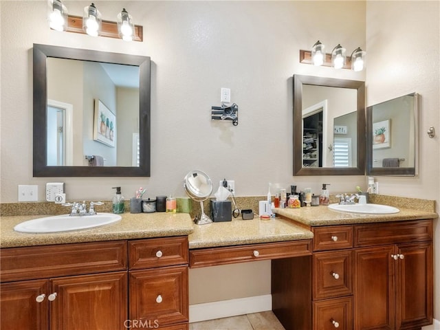 bathroom with tile patterned floors and vanity