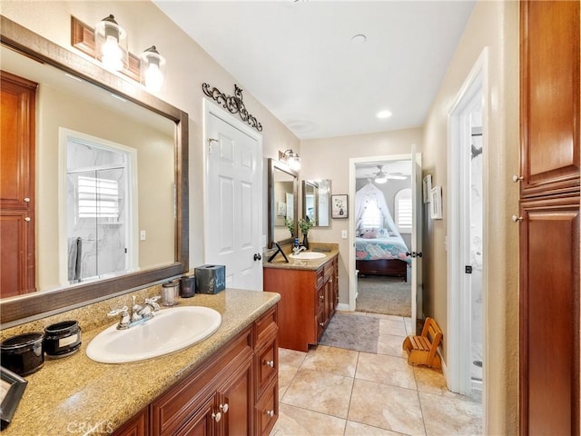 full bathroom featuring tile patterned floors, a ceiling fan, ensuite bathroom, and a sink