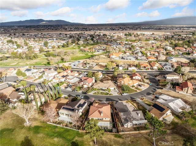 birds eye view of property with a mountain view and a residential view