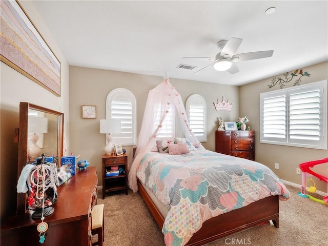 bedroom featuring baseboards, carpet, visible vents, and ceiling fan