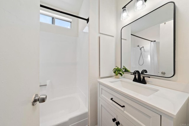 bathroom with vanity and bathtub / shower combination