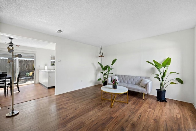 471 S Lincoln Ave, El Cajon, CA 92020 - living room featuring ceiling fan, visible vents, a textured ceiling, and wood finished floors