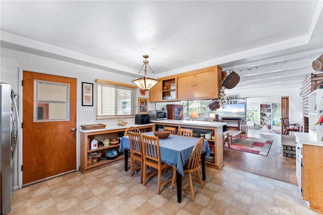 dining room featuring a wealth of natural light and light floors