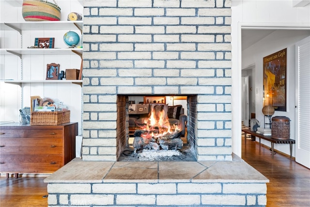 details with wood finished floors and a fireplace