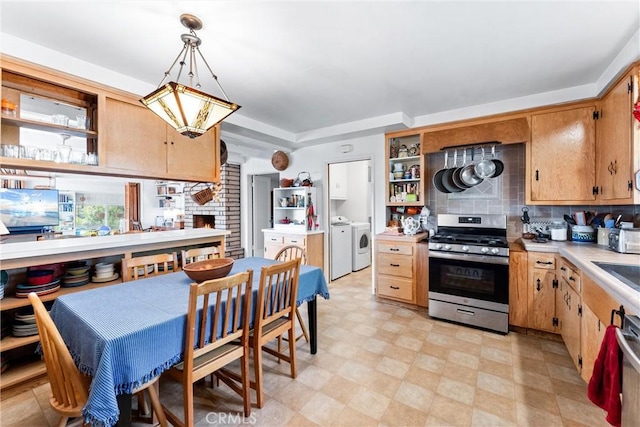 kitchen with light floors, open shelves, stainless steel range with gas stovetop, decorative backsplash, and light countertops