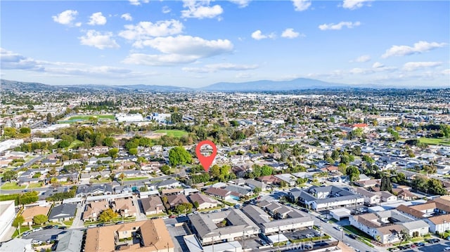 drone / aerial view featuring a mountain view and a residential view