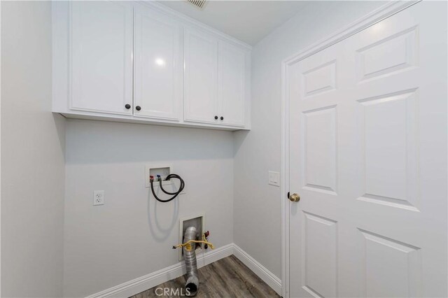 laundry room featuring washer hookup, dark wood-style floors, cabinet space, and baseboards