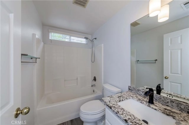 bathroom with vanity, shower / bathing tub combination, toilet, and visible vents