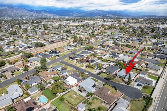 drone / aerial view featuring a mountain view and a residential view