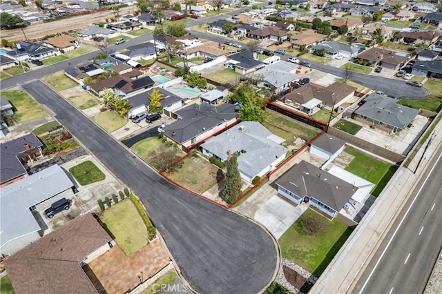 birds eye view of property with a residential view