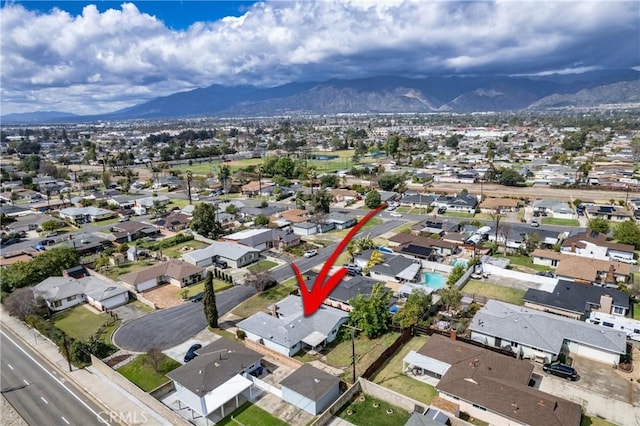 aerial view with a mountain view and a residential view