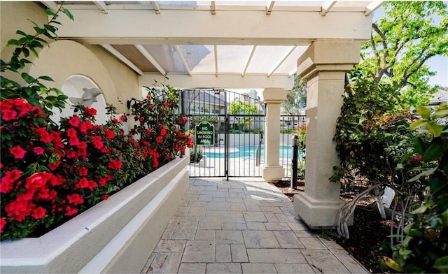 view of patio / terrace with a gate and fence