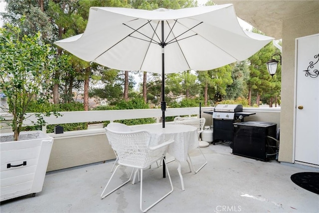 view of patio / terrace with outdoor dining space and a grill