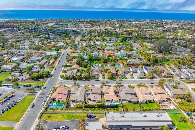 bird's eye view with a residential view and a water view