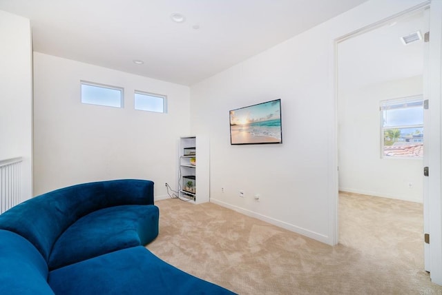 living area with recessed lighting, baseboards, visible vents, and carpet floors