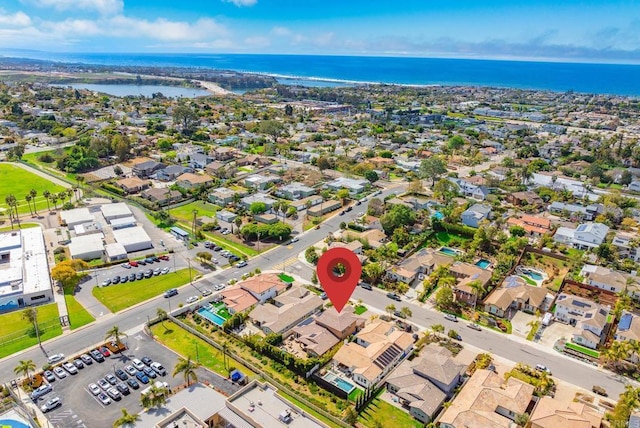 drone / aerial view with a residential view and a water view