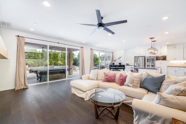 living room with visible vents, baseboards, recessed lighting, dark wood-style flooring, and ceiling fan