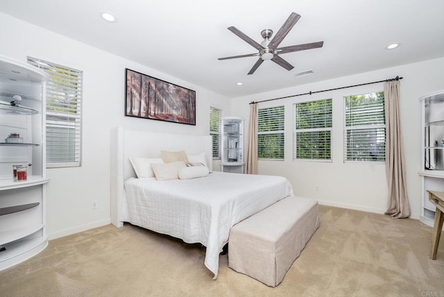 bedroom featuring recessed lighting, light colored carpet, and baseboards