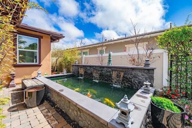 view of patio featuring fence