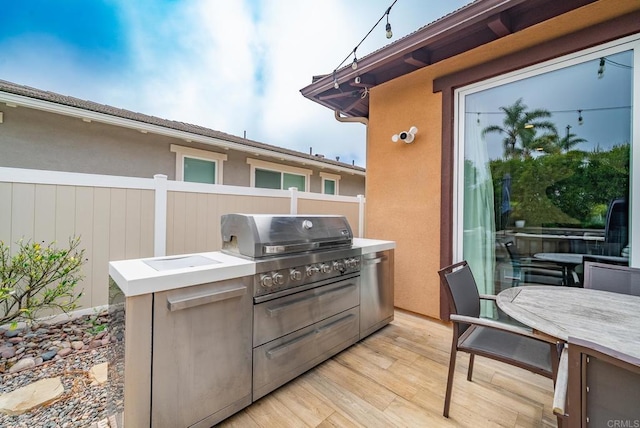 view of patio featuring fence