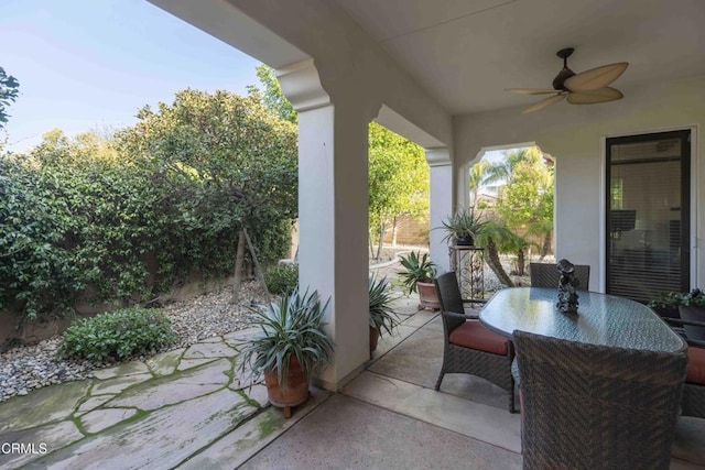 view of patio / terrace featuring outdoor dining area and a ceiling fan