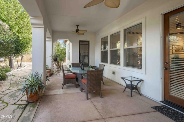 view of patio featuring outdoor dining area and ceiling fan