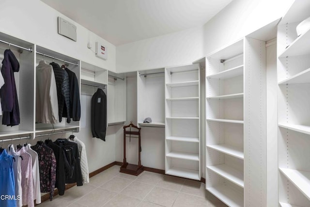 spacious closet with tile patterned floors