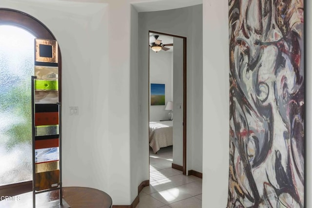 corridor featuring light tile patterned flooring