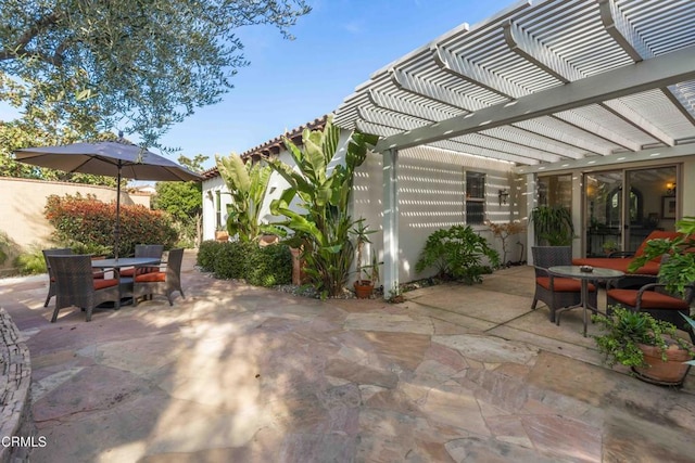 view of patio / terrace featuring outdoor dining space and a pergola